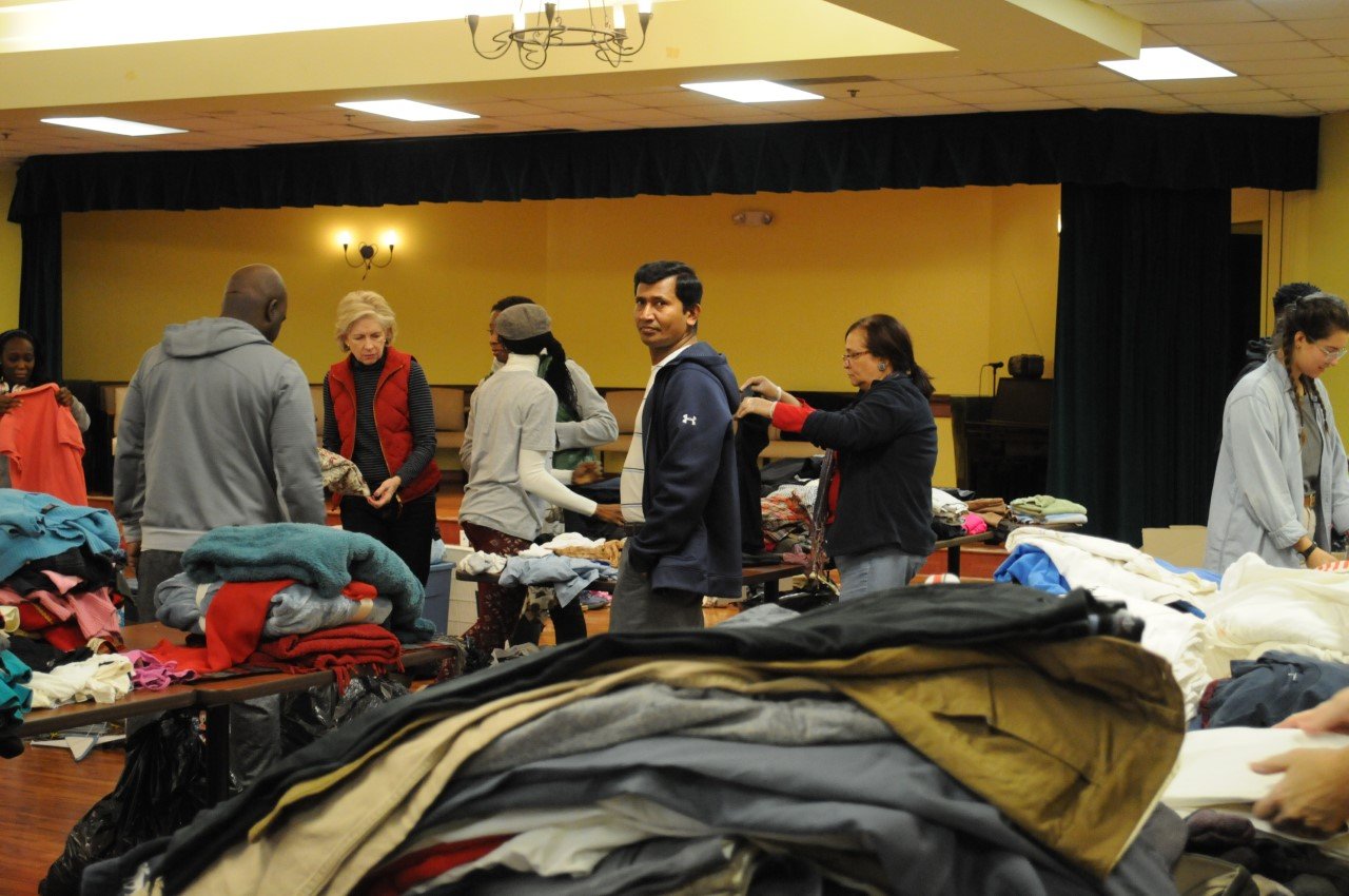 Community members at a clothing outreach event